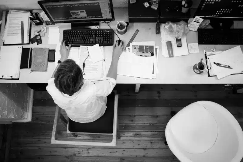 overhead shot of an employee at their desk