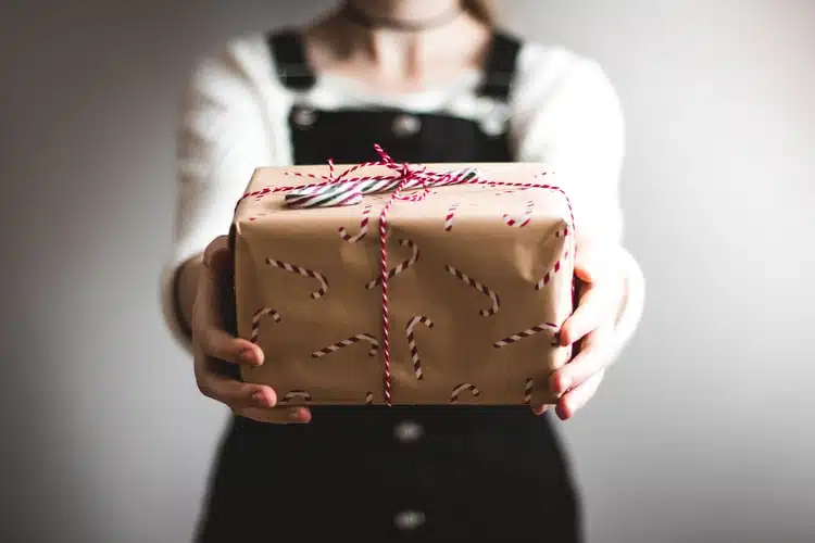 a person holding a gift