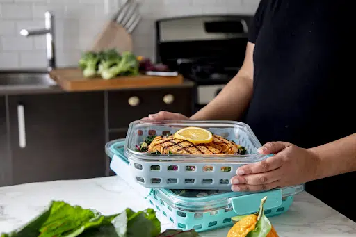 Household personal assistant preparing meals