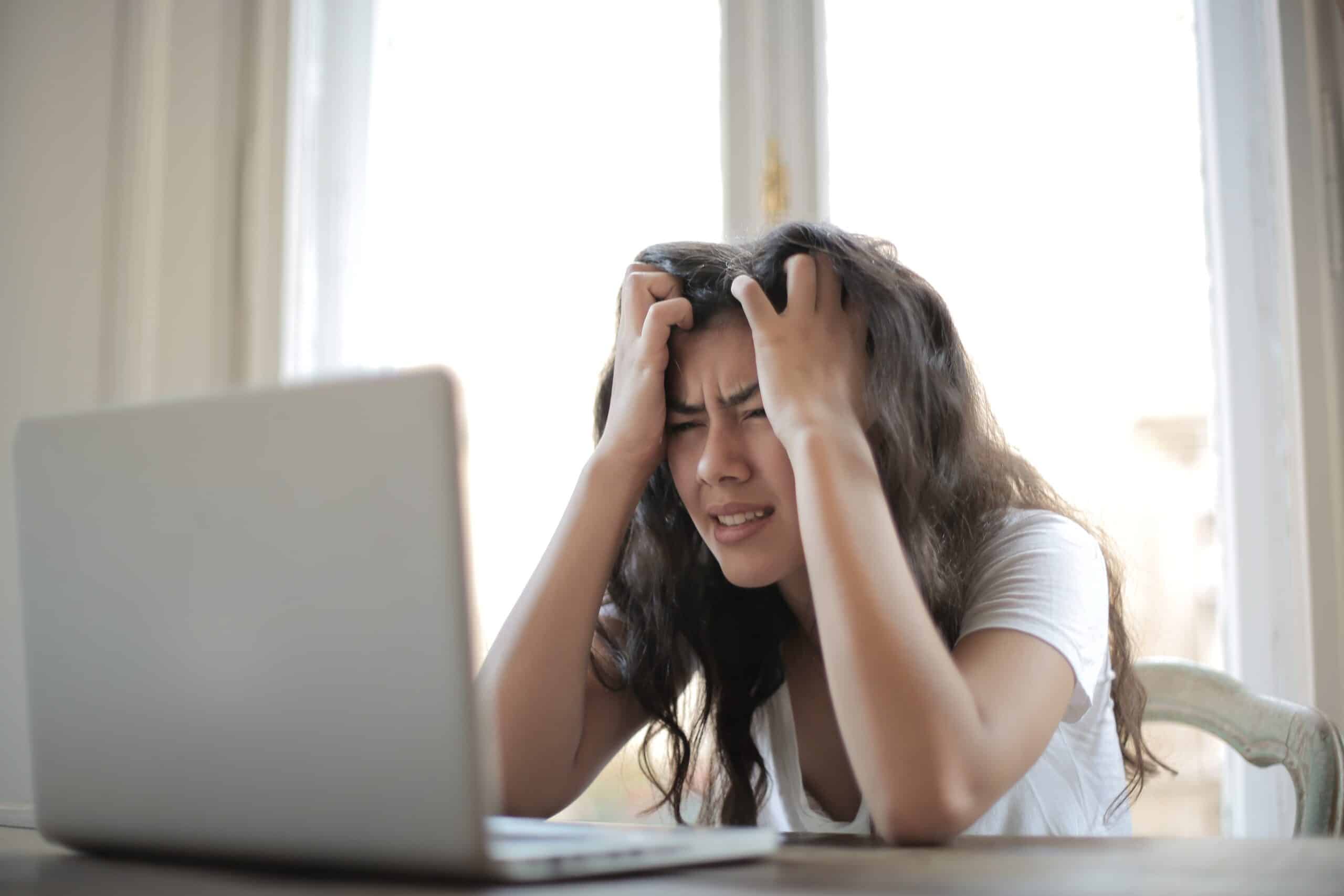 woman stressed at laptop