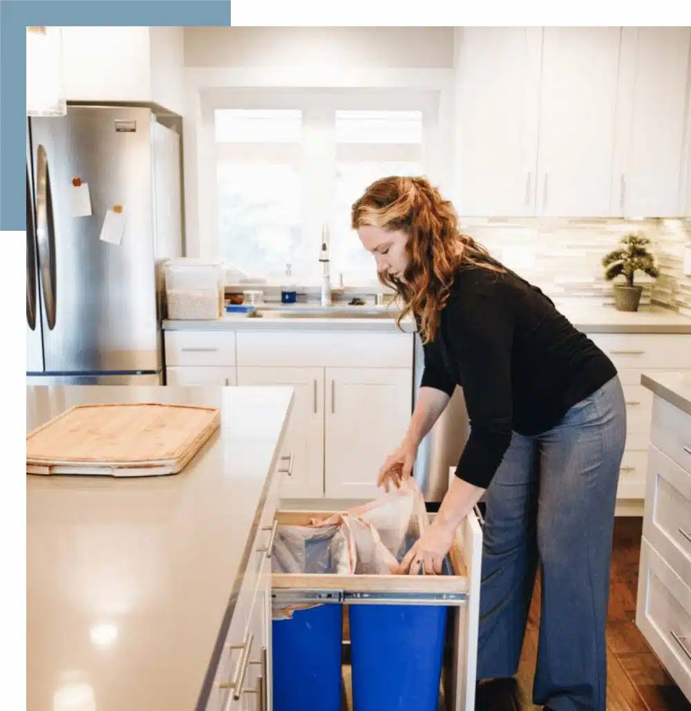 Female assistant taking the trash out